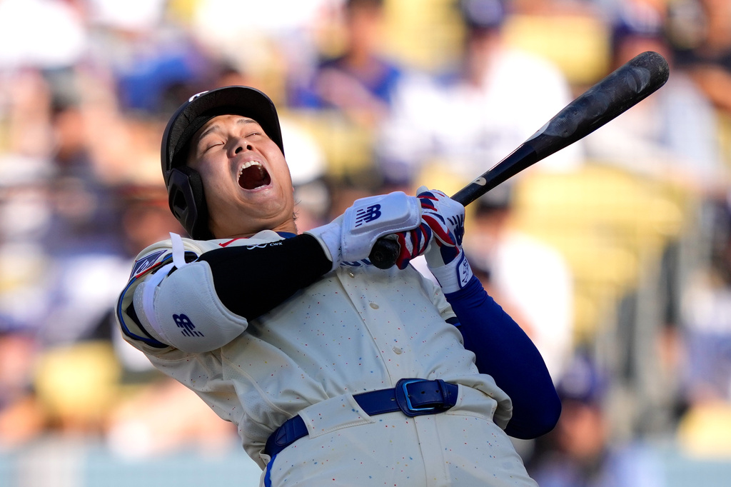 Los Angeles Dodgers' Shohei Ohtani ducks out of the way of a close pitch during the third inning of a baseball game against the Pittsburgh Pirates, Saturday, Aug. 22, 2026, in Los Angeles. (AP Photo/Mark J. Terrill)