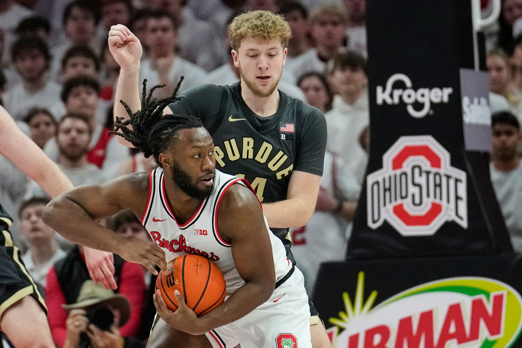 Ohio State guard Bruce Thornton, front, drives against Purdue guard Jack Benter, rear, in the first half of an NCAA college basketball game Sunday, March 1, 2026, in Columbus, Ohio. (AP Photo/Sue Ogrocki)