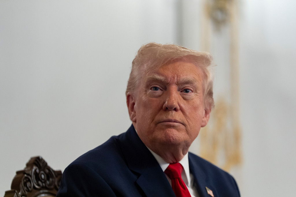 President Donald Trump speaks to reporters after speaking to troops via video from his Mar-a-Lago estate on Thanksgiving, Thursday, Nov. 27, 2025, in Palm Beach, Fla. (AP Photo/Alex Brandon)