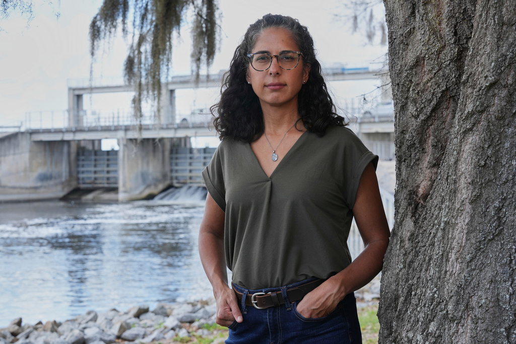Nina Bhattacharyya, executive director of Florida Defenders of the Environment, stands near the Kirkpatrick Dam on Wednesday, March 4, 2026, in Palatka, Fla. (AP Photo/Marta Lavandier)