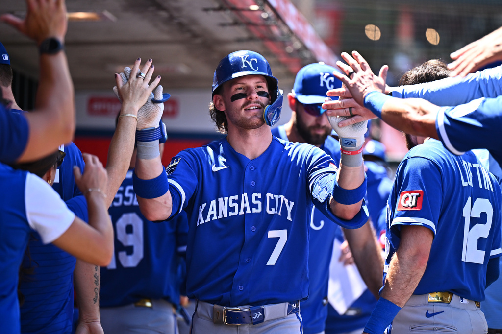 Kansas City Royals' Bobby Witt Jr. (7) is greeted by teammates after hitting a solo home run during the fifth inning of a baseball game against the Los Angeles Angels, Sunday, Aug. 16, 2026, in Anaheim, Calif. (AP Photo/William Liang)