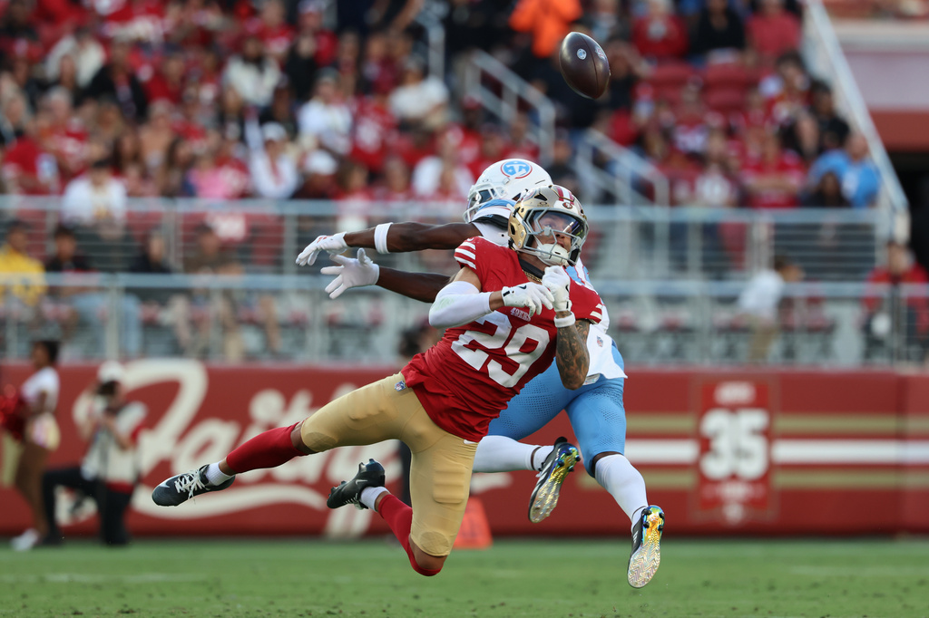San Francisco 49ers defensive back Ashtyn Davis (29) breaks up a pass intended for Tennessee Titans wide receiver Carnell Tate during the first half of a preseason NFL football game, Thursday, Aug. 13, 2026, in Santa Clara, Calif. (AP Photo/Jed Jacobsohn)