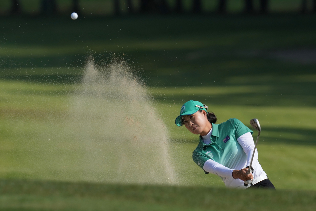 Minjee Lee of Australia hits out of a bunker on the 14th hole during the pool A match against the United States team for the LPGA International Crown golf tournament at the New Korea Country Club in Goyang, South Korea, Saturday, Oct. 25, 2025. (AP Photo/Lee Jin-man)