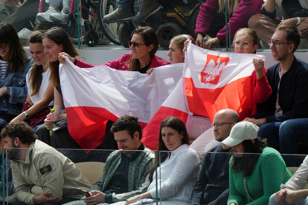 Polish fans cheer during the final tennis match between Poland's Maja Chwalinska and Russia's Mirra Andreeva at the French Open in Paris, Saturday, June 6, 2026. (AP Photo/Aurelien Morissard)