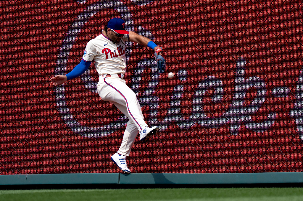 Philadelphia Phillies right fielder Gabriel Rincones is unable to catch a hit by New York Mets' Tyrone Taylor during the fifth inning of a baseball game, Sunday, July 19, 2026, in Philadelphia. (AP Photo/Chris Szagola)