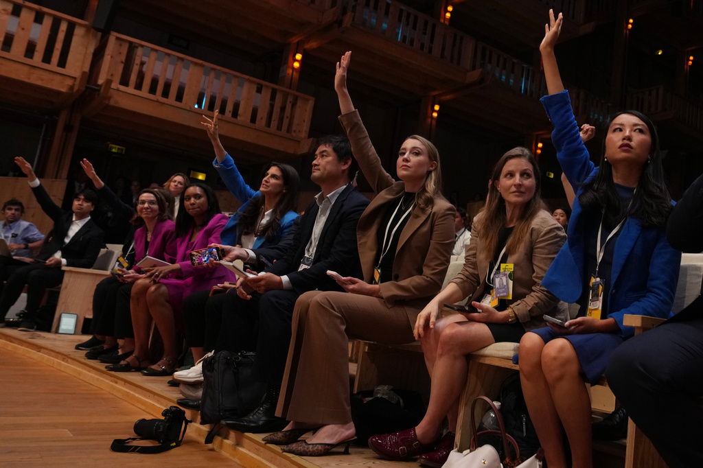 Members of the media raise their hands as U.S. President Donald Trump speaks during a news conference at the G7 summit, Wednesday, June 17, 2026, in Evian-les-Bains, France. (AP Photo/Julia Demaree Nikhinson)