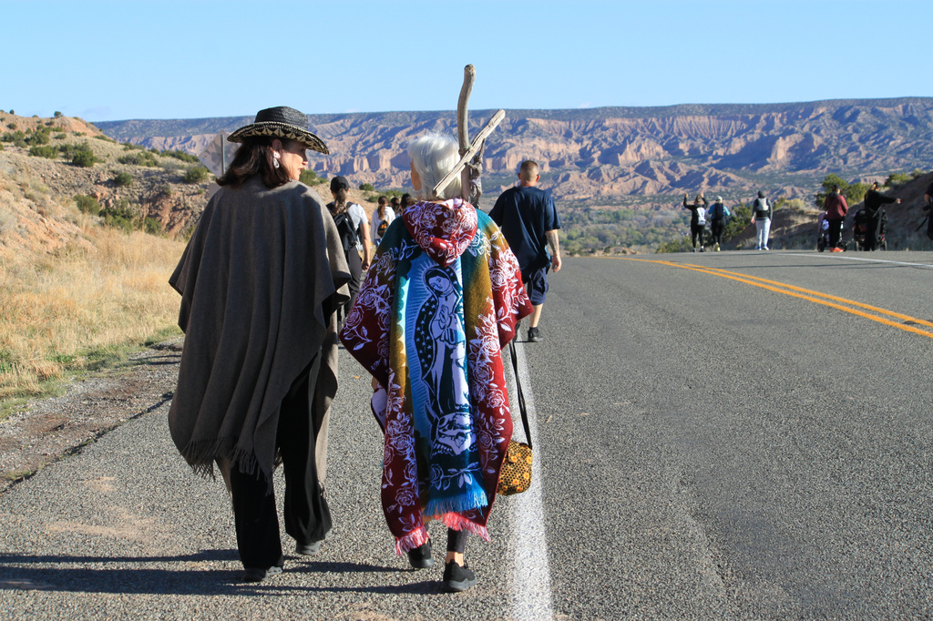 Dianne De Leon, left, and her mother, Victoria Trujillo, right, make the Good Friday pilgrimage to El Santuario de Chimayó in Chimayó, New Mexico, on Friday, April 3, 2026. (AP Photo/Susan Montoya Bryan) CORRECTION: Corrects spelling from Diane to Dianne