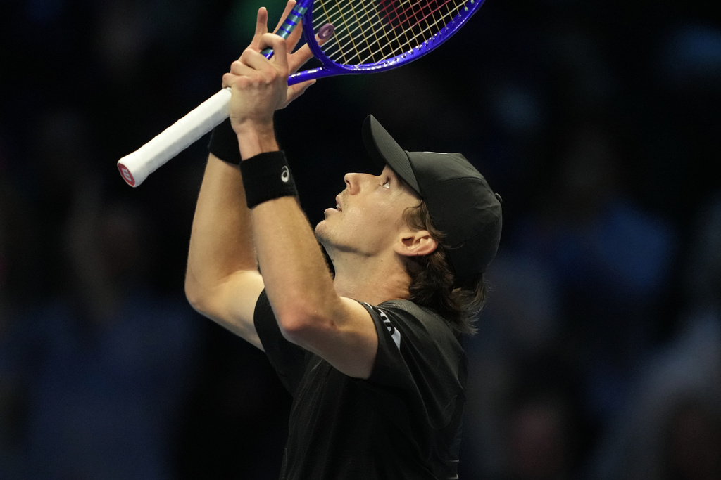 Australia's Alex de Minaur celebrates after winning against United States' Taylor Fritz during the tennis match of the ATP World Tour Finals, in Turin, Italy, Thursday, Nov. 13, 2025. (AP Photo/Antonio Calanni)