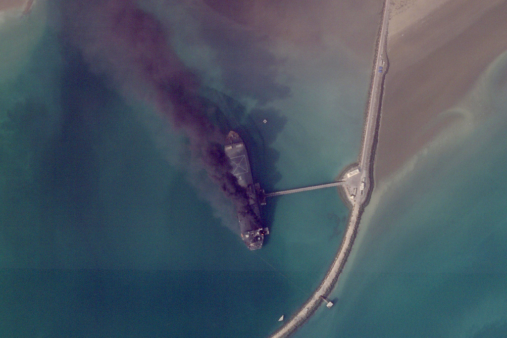 This satellite image from Planet Labs PBC shows fires burning on a ship after a U.S. military attack on a port in Bandar Abbas, Iran, March 2, 2026. (Planet Labs PBC via AP)