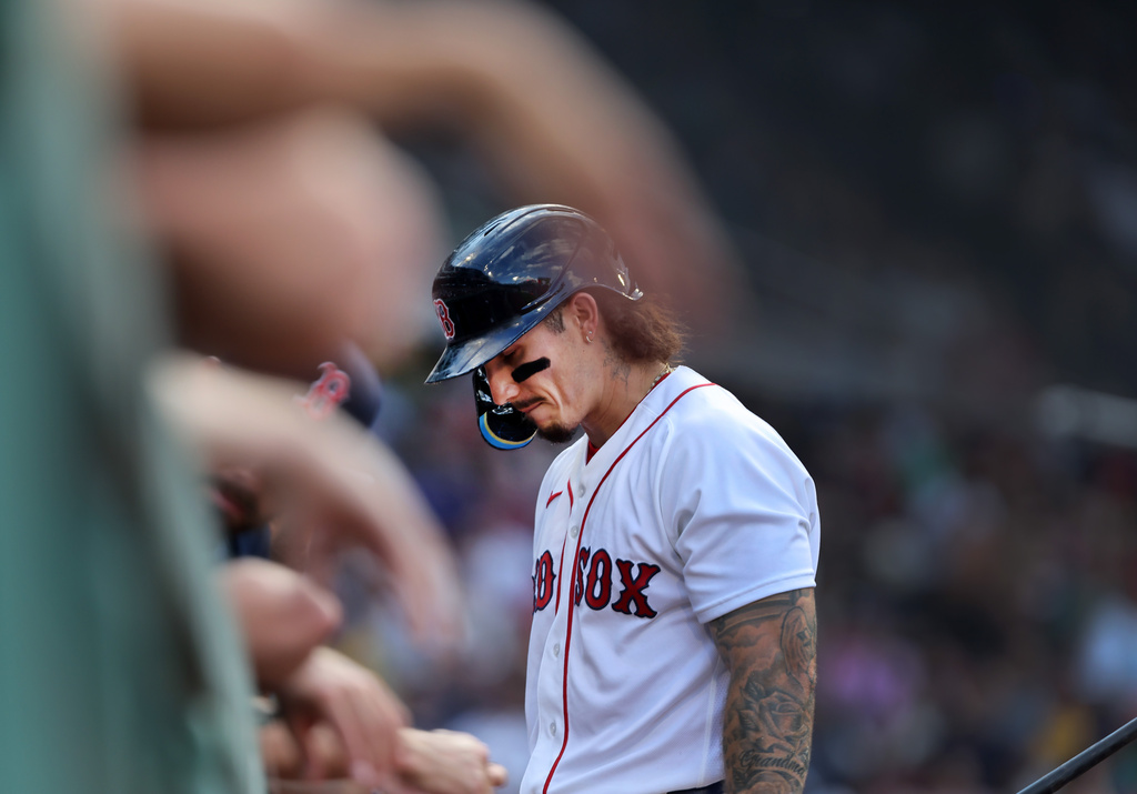 Boston Red Sox's Jarren Duran walks into the dugout after striking out in the fourth inning of a baseball game against the Athletics, Saturday, Aug. 8, 2026, in Boston. (AP Photo/Jim Davis)