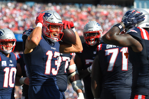 New England Patriots wide receiver Mack Hollins (13) celebrates with teammates after scoring a touchdown against the Carolina Panthers during the second half of an NFL football game, Sunday, Sept. 28, 2025, in Foxborough, Mass. (AP Photo/Steven Senne) New England Patriots wide receiver Mack Hollins (13) celebrates with teammates after scoring a touchdown against the Carolina Panthers during the second half of an NFL football game, Sunday, Sept. 28, 2025, in Foxborough, Mass. (AP Photo/Steven Senne)