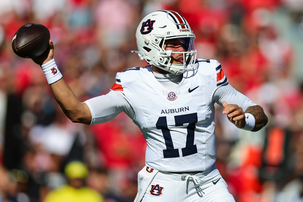 Auburn quarterback Byrum Brown (17) throws a pass during the first half of an NCAA college football game against Georgia, Saturday, Oct. 17, 2026, in Athens, Ga. (AP Photo/Colin Hubbard)