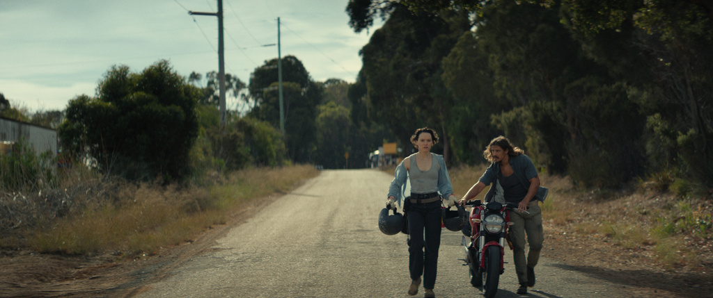 This image released by Vertical shows Daisy Ridley, left, and Brenton Thwaites in a scene from "We Bury the Dead." (Vertical via AP)
