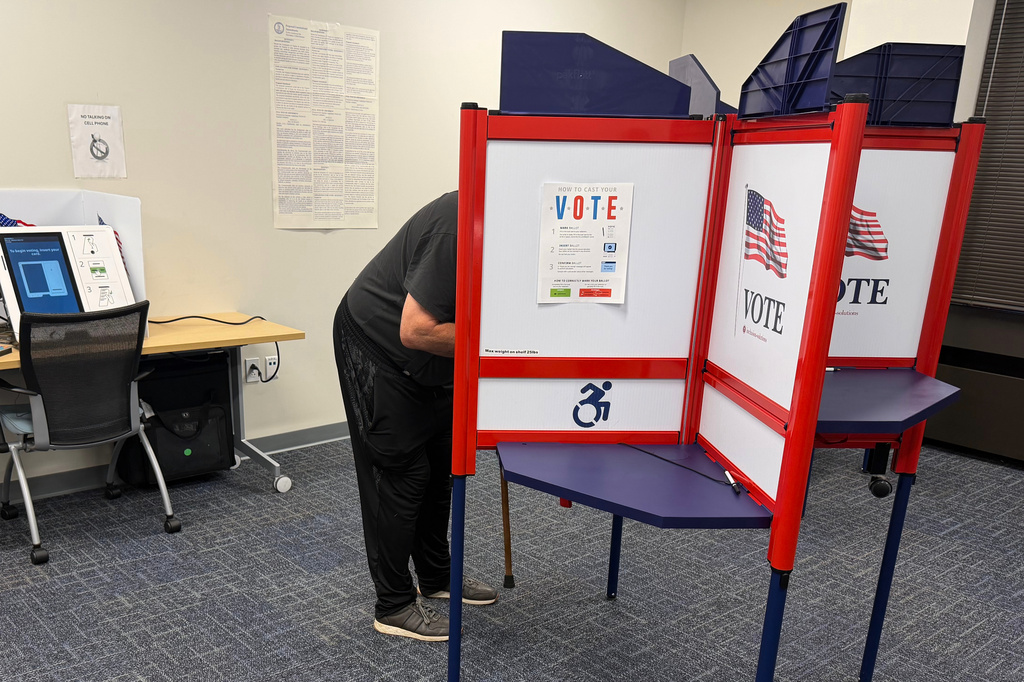 A voter casts a ballot in Henrico County, Va., on the first day of in-person early voting Friday, Sept. 18, 2026. (AP Photo/Sarah Rankin)