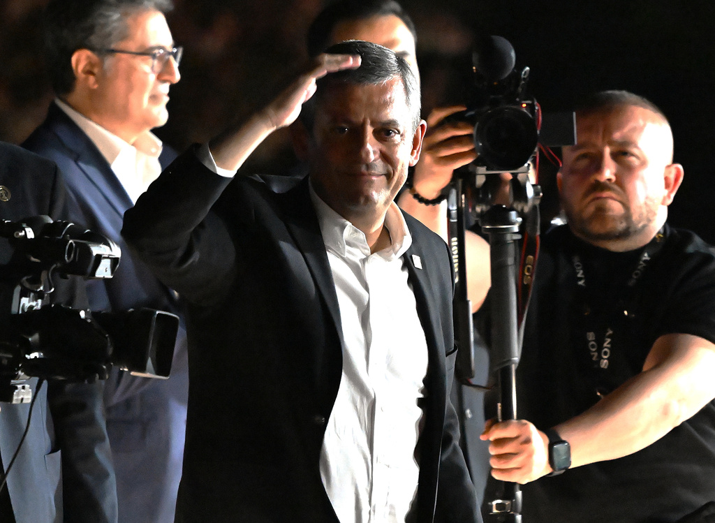Leader of Turkey's main opposition Republican People's Party (CHP), Ozgur Ozel, addresses supporters gather outside the party's headquarters in Ankara on Friday, May 22, 2026. (AP Photo/Ali Unal)