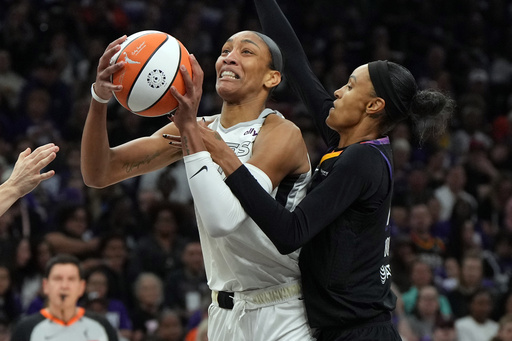 Phoenix Mercury forward DeWanna Bonner, right, fouls Las Vegas Aces center A'ja Wilson, left, during the first half of Game 4 of the WNBA basketball finals, Friday, Oct. 10, 2025, in Phoenix. (AP Photo/Rick Scuteri) Phoenix Mercury forward DeWanna Bonner, right, fouls Las Vegas Aces center A'ja Wilson, left, during the first half of Game 4 of the WNBA basketball finals, Friday, Oct. 10, 2025, in Phoenix. (AP Photo/Rick Scuteri)