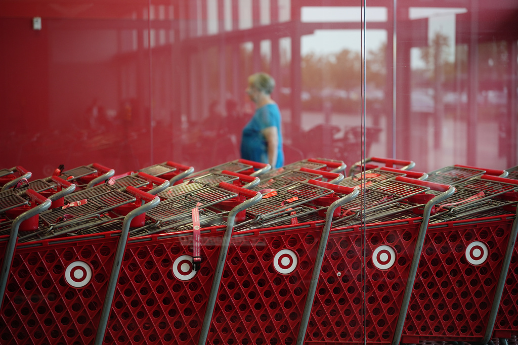 A shopper enters a Target store, Thursday, Aug. 13, 2026, in Woodbury, Minn. (AP Photo/Ellen Schmidt)