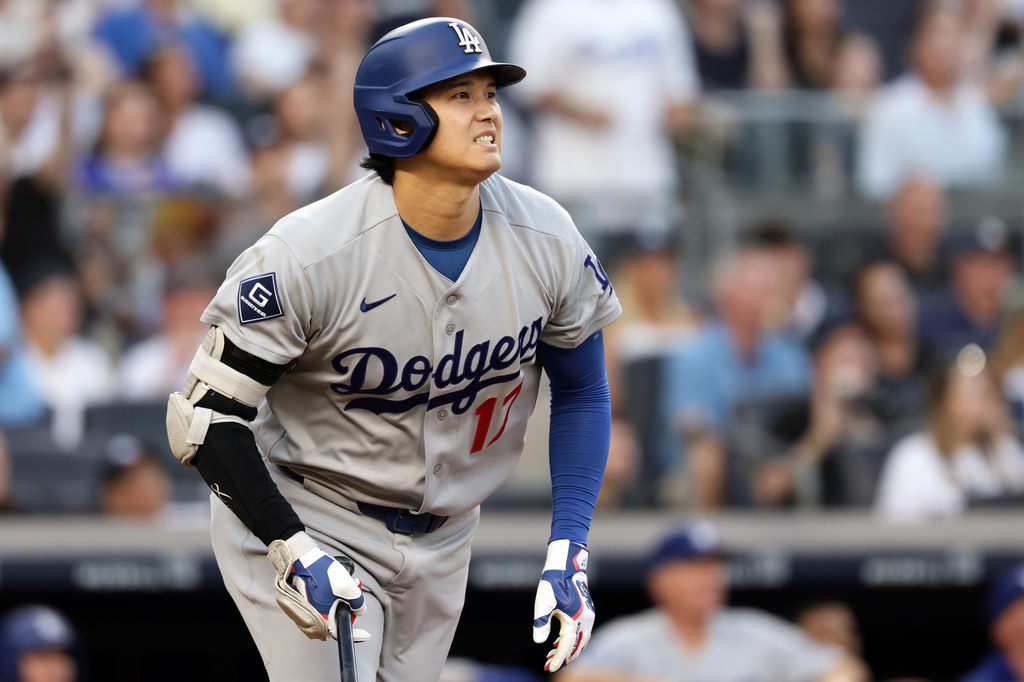 Los Angeles Dodgers designated hitter Shohei Ohtani reacts while watching his flyout during the third inning of a baseball game against the New York Yankees, Friday, July 17, 2026, in New York. (AP Photo/Adam Hunger)