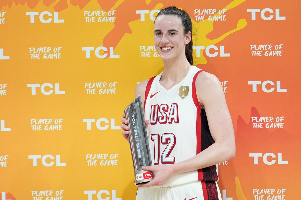 United States' Caitlin Clark holds the trophy for the player of the game during the Women's Basketball World Cup match between China and the United States in Berlin, Friday, Sept. 4, 2026. (AP Photo/Ebrahim Noroozi)