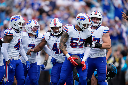 Buffalo Bills defensive end AJ Epenesa (57) reacts after making an interception against the Carolina Panthers during the first half an NFL football game, Sunday, Oct. 26, 2025, in Charlotte, N.C. (AP Photo/Erik Verduzco) Buffalo Bills defensive end AJ Epenesa (57) reacts after making an interception against the Carolina Panthers during the first half an NFL football game, Sunday, Oct. 26, 2025, in Charlotte, N.C. (AP Photo/Erik Verduzco)