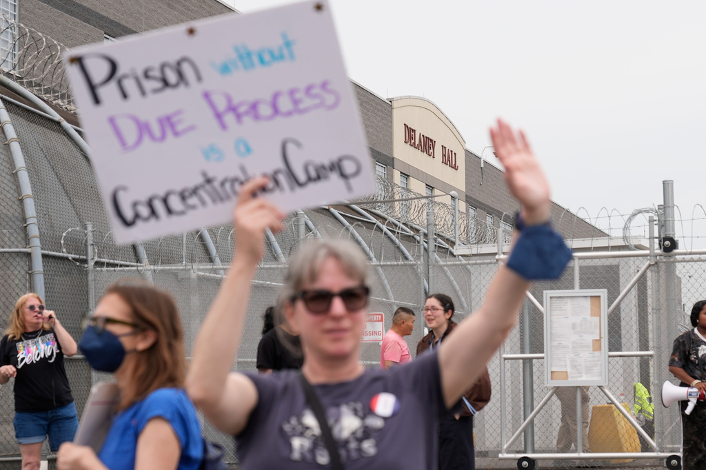 Demonstrators stand outside the Delaney Hall detention center during a protest against the transfer of detainees on Wednesday, May 27, 2026, in Newark, N.J. (AP Photo/Seth Wenig)