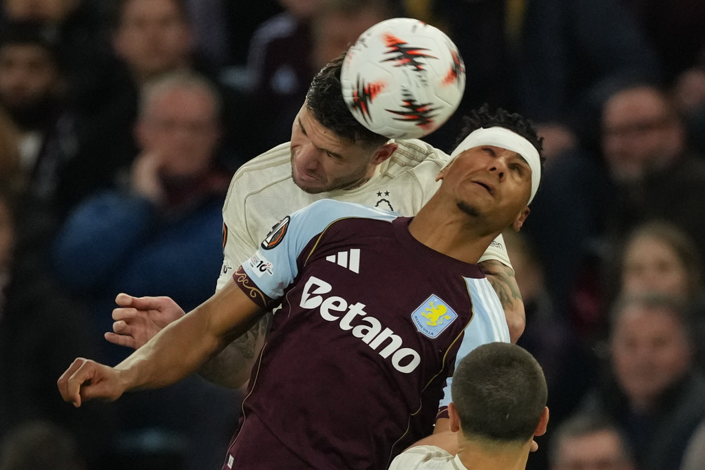 Nottingham Forest's Morato, back, and Aston Villa's Ollie Watkins jump for the ballduring the Europa League second-leg semifinal soccer match between Aston Villa and Nottingham in Birmingham, England, Thursday, May 7, 2026. (AP Photo/Dave Shopland)