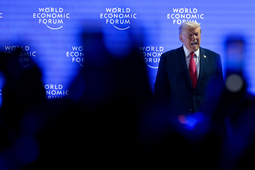 President Donald Trump walks on to the stage during the 56th annual meeting of the World Economic Forum, WEF, in Davos, Switzerland, Wednesday, Jan. 21, 2026. (Gian Ehrenzeller/Keystone via AP)