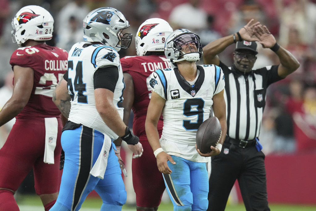 Carolina Panthers quarterback Bryce Young (9) reacts during the second half of an NFL football game against the Arizona Cardinals, Sunday, Sept. 14, 2025, in Glendale, Ariz. (AP Photo/Ross D. Franklin)