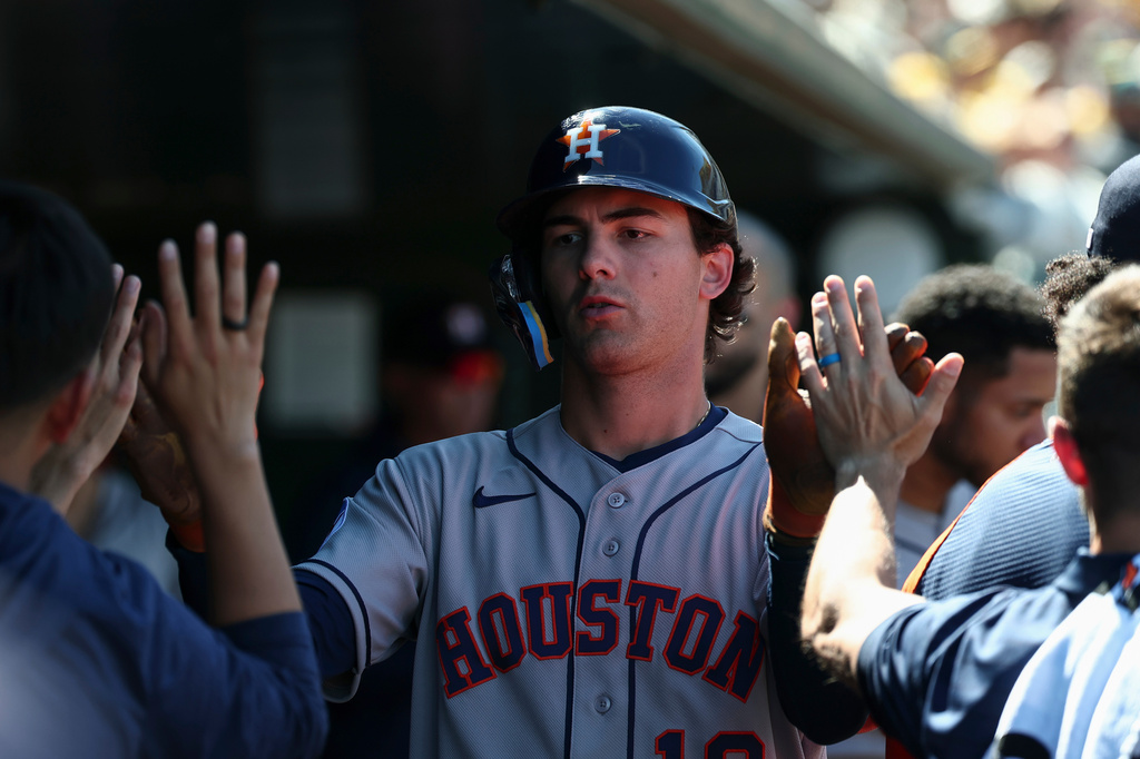 Houston Astros' Joey Loperfido celebrates in the dugout after scoring during the sixth inning of a baseball game against the Athletics, Saturday, April 4, 2026, in West Sacramento, Calif. (AP Photo/Sara Nevis)