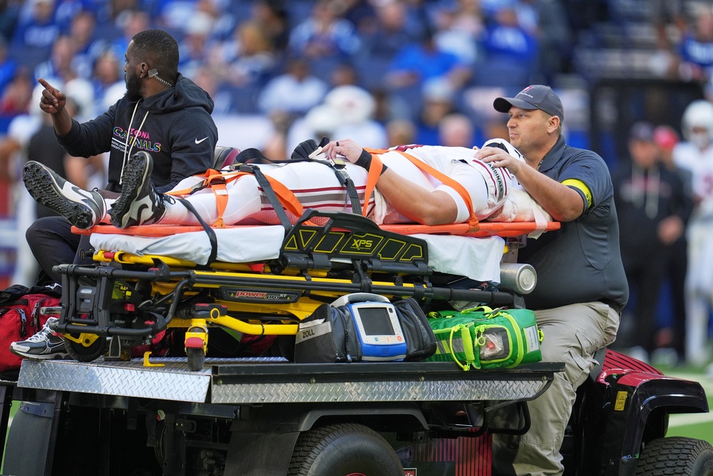 Arizona Cardinals' Travis Vokolek is taken off the field on a cart during the first half of an NFL football game against the Indianapolis Colts Sunday, Oct. 12, 2025, in Indianapolis. (AP Photo/Michael Conroy)
