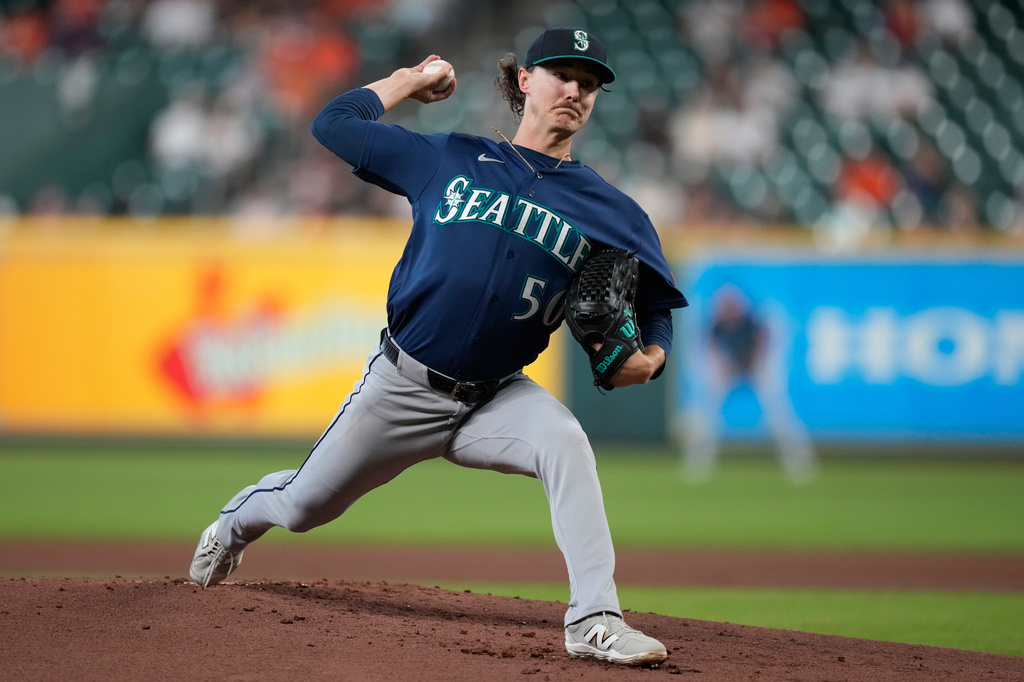 Seattle Mariners starting pitcher Bryce Miller throws during the first inning of a baseball game against the Houston Astros in Houston, Wednesday, May 13, 2026. (AP Photo/Ashley Landis)