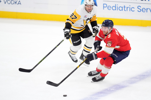 Florida Panthers center Sam Bennett (9) controls the puck under pressure from Pittsburgh Penguins center Sidney Crosby (87) during the first period of an NHL hockey game, Thursday, Oct. 23, 2025, in Sunrise, Fla. (AP Photo/Rebecca Blackwell) Florida Panthers center Sam Bennett (9) controls the puck under pressure from Pittsburgh Penguins center Sidney Crosby (87) during the first period of an NHL hockey game, Thursday, Oct. 23, 2025, in Sunrise, Fla. (AP Photo/Rebecca Blackwell)