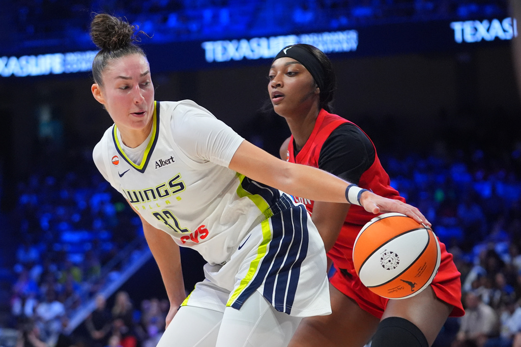 Dallas Wings forward Jessica Shepard (32) moves the ball against Atlanta Dream forward Angel Reese during the first half of a WNBA basketball game in Arlington, Texas, Wednesday, July 29, 2026. (AP Photo/LM Otero)