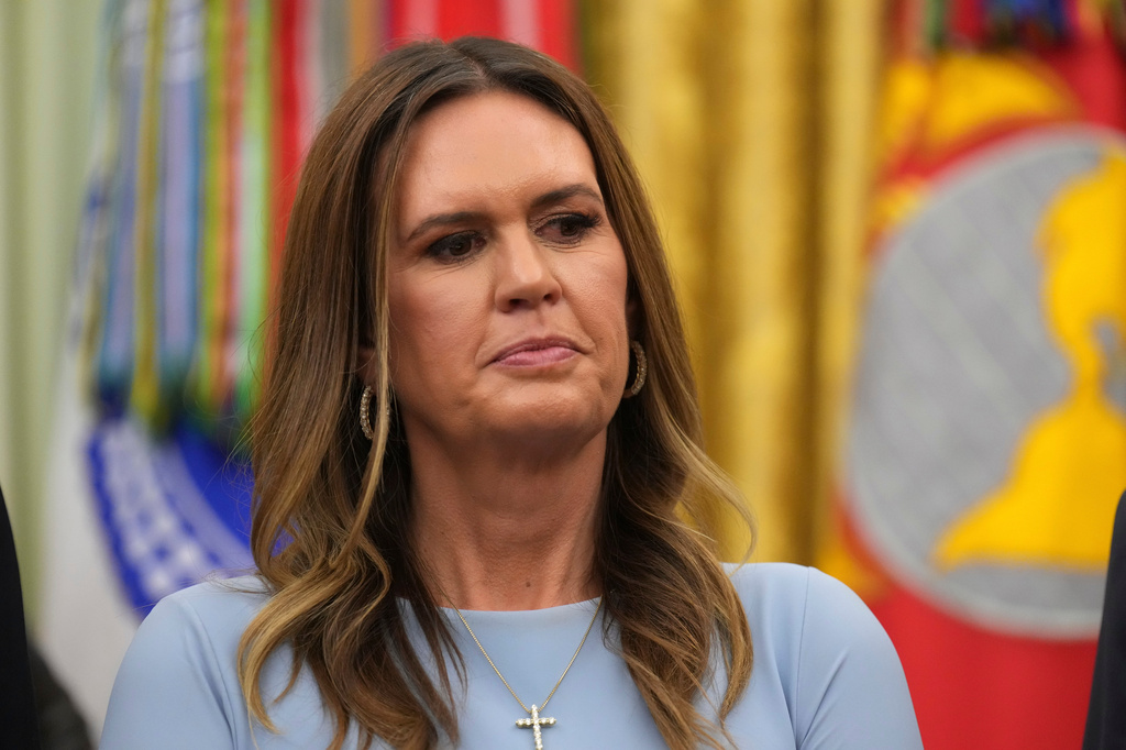 Arkansas Gov. Sarah Huckabee Sanders listens as President Donald Trump speaks during an event about healthcare in the Oval Office of the White House, Friday Sept. 18, 2026, in Washington. (AP Photo/Jacquelyn Martin)