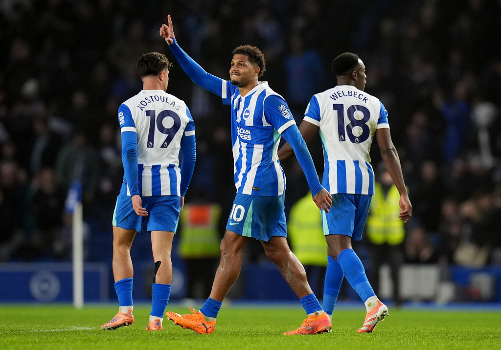 Brighton and Hove Albion's Georginio Rutter, centre, celebrates after scoring his sides first goal during the English Premier League soccer match between Brighton and Hove Albion v West Ham United, in Brighton, England, Sunday, Dec. 7, 2025. (Gareth Fuller/PA via AP)