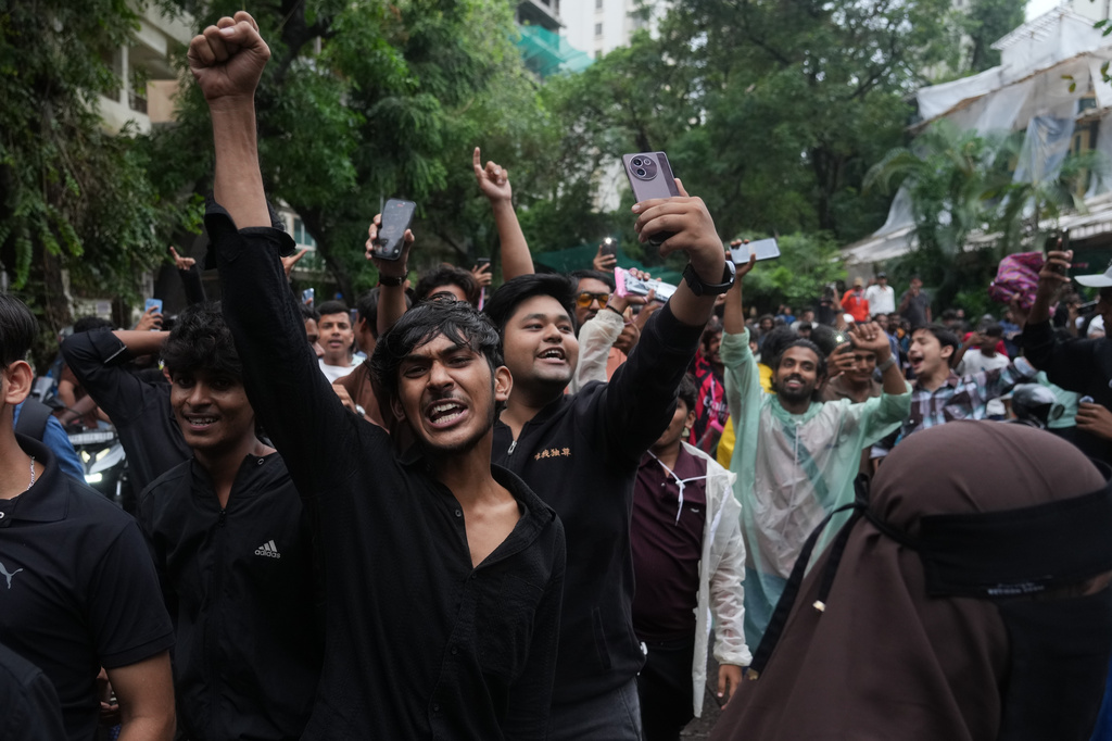 Protesters shout slogans during a demonstration demanding educational reforms as part of the Cockroach Janta Party's ongoing protest movement in Mumbai, India, Thursday, July 23, 2026. (AP Photo/Rafiq Maqbool)