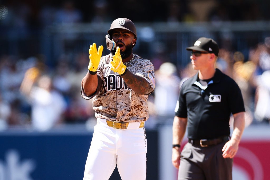 San Diego Padres' Luis Rengifo, left, celebrates after hitting a two-RBI double against Minnesota Twins in the sixth inning of a baseball game Sunday, Aug. 23, 2026, in San Diego. (AP Photo/Derrick Tuskan)