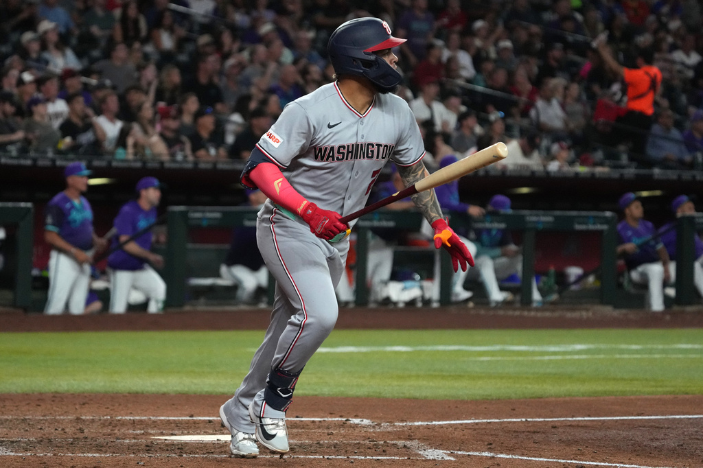 Washington Nationals' Luis García Jr. watches his grand slam against the Arizona Diamondbacks in the sixth inning of a baseball game, Friday, June 5, 2026, in Phoenix. (AP Photo/Rick Scuteri)