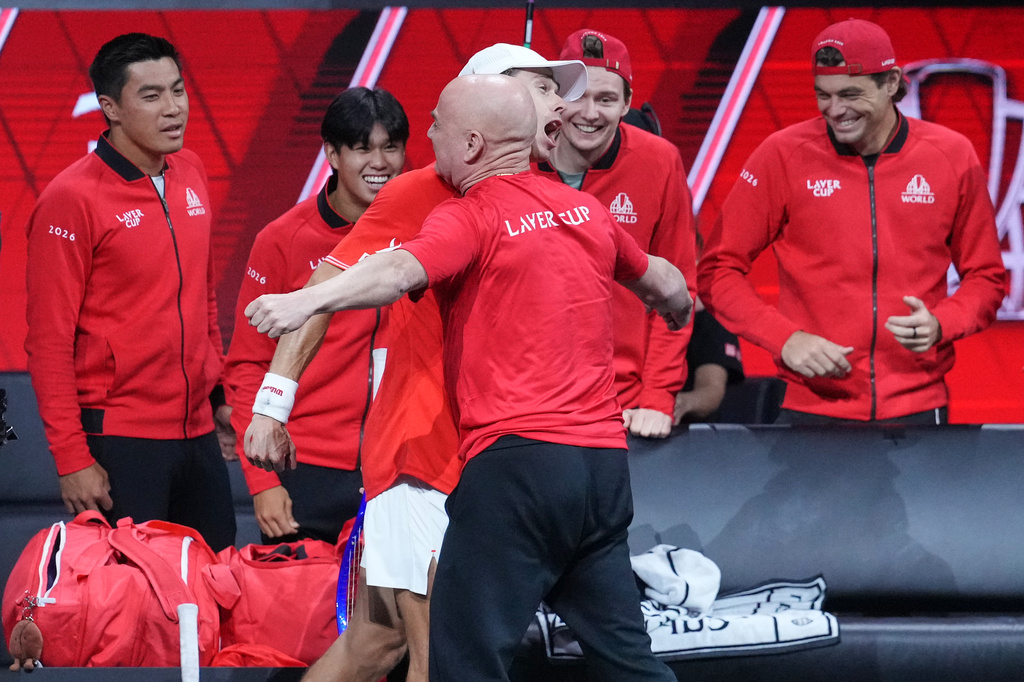 Team World's Alex De Minaur celebrates with Team World captain Andre Agassi after beating Team Europe's Alexander Zverev in a Laver Cup tennis tournament match in London, Saturday, Sept. 26, 2026. (AP Photo/Maja Smiejkowska)