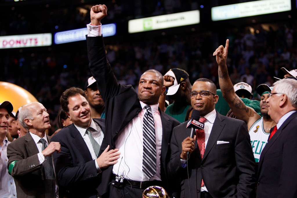 FILE - Head coach Doc Rivers and Boston Celtics team owner Steve Pagliuca, second from left, celebrate after defeating the Los Angeles Lakers in Game 6 of the NBA basketball finals, June 17, 2008, in Boston. (AP Photo/Elise Amendola, File)