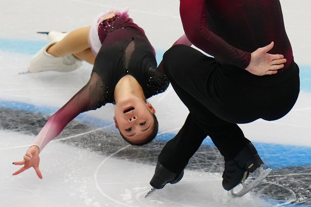 Sui Wenjing and Han Cong, of China, compete in the Pairs Short Program at the ISU Four Continents Figure Skating Championships, in Beijing, China, Thursday, Jan. 22, 2026. (AP Photo/Andy Wong)