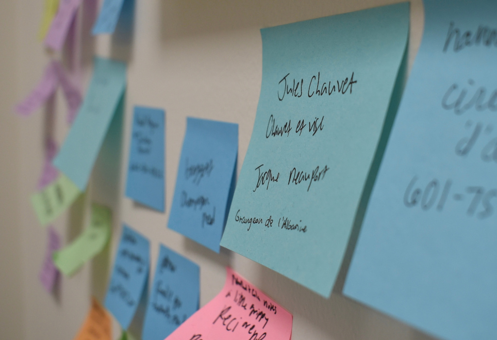 Sticky notes with customers' names and the wines they want are displayed for Brandi Carter, the owner of Levure Bottle Shop, so she can notify them when the wines are back in stock, in Jackson, Miss., Wednesday, April 15, 2026. (AP Photo/Sophie Bates)