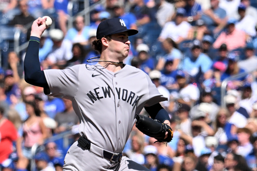 New York Yankees pitcher Cam Schlittler (31) throws to a Toronto Blue Jays batter during the first inning of a baseball game in Toronto, Saturday, Aug. 15, 2026. (Jon Blacker/The Canadian Press via AP)