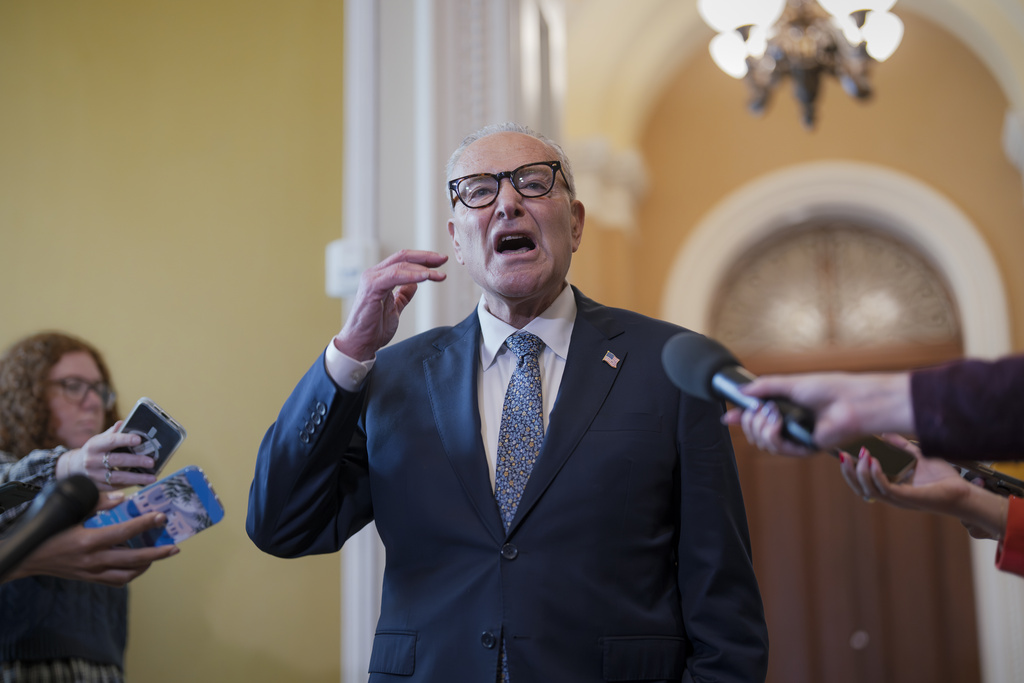 Senate Minority Leader Chuck Schumer, D-N.Y., holds an impromptu news conference with reporters just outside the chamber to say he has filed an amendment on the Senate floor to require the attorney general to release the Epstein files and Republicans will have to vote on it, at the Capitol in Washington, Wednesday, Sept. 10, 2025. (AP Photo/J. Scott Applewhite)