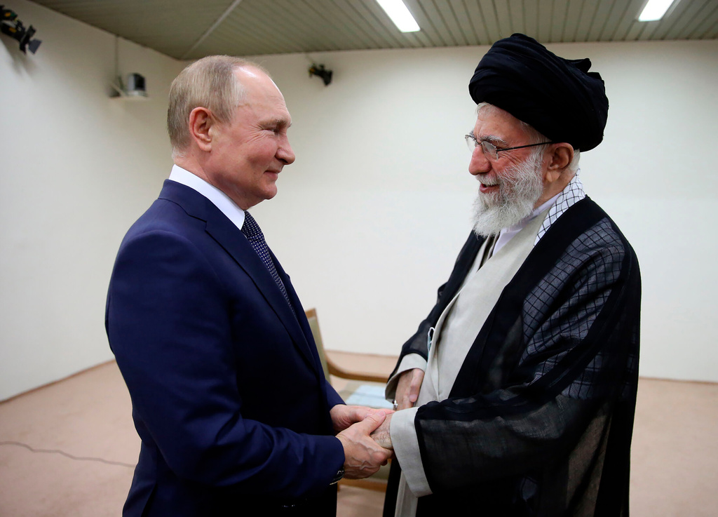 FILE - In this picture released by the official website of the office of the Iranian supreme leader Supreme Leader Ayatollah Ali Khamenei, right, and Russian President Vladimir Putin greet each other during their meeting in Tehran, Iran, July 19, 2022. (Office of the Iranian Supreme Leader via AP, File)
