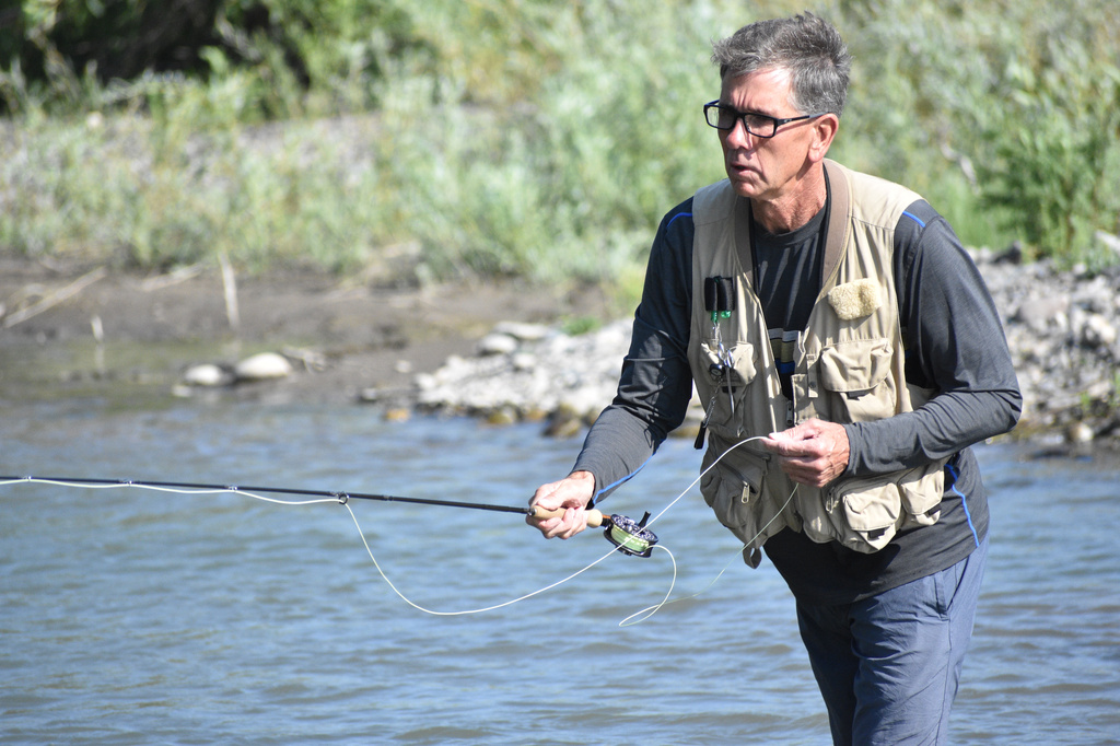 Mike Wever is seen fishing on the Yellowstone River, Friday, July 31, 2026, near Livingston, Montana. (AP Photo/Matthew Brown)