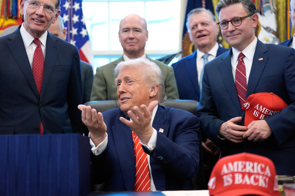 President Donald Trump speaks to reporters after signing a spending bill that ends a partial shutdown of the federal government in the Oval Office of the White House, Tuesday, Feb. 3, 2026, in Washington. (AP Photo/Alex Brandon)
