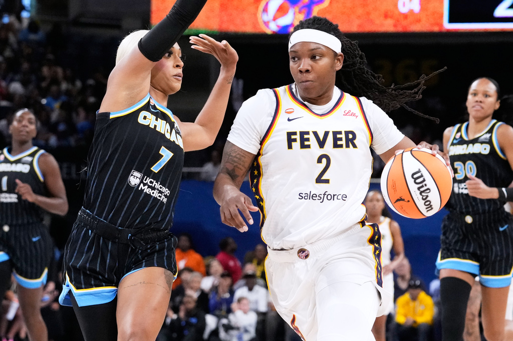 Chicago Sky guard-forward DiJonai Carrington (7) guards against Indiana Fever forward Myisha Hines-Allen (2) during the first half of a WNBA basketball game Sunday, Aug. 23, 2026, in Chicago. (AP Photo/Nam Y. Huh)