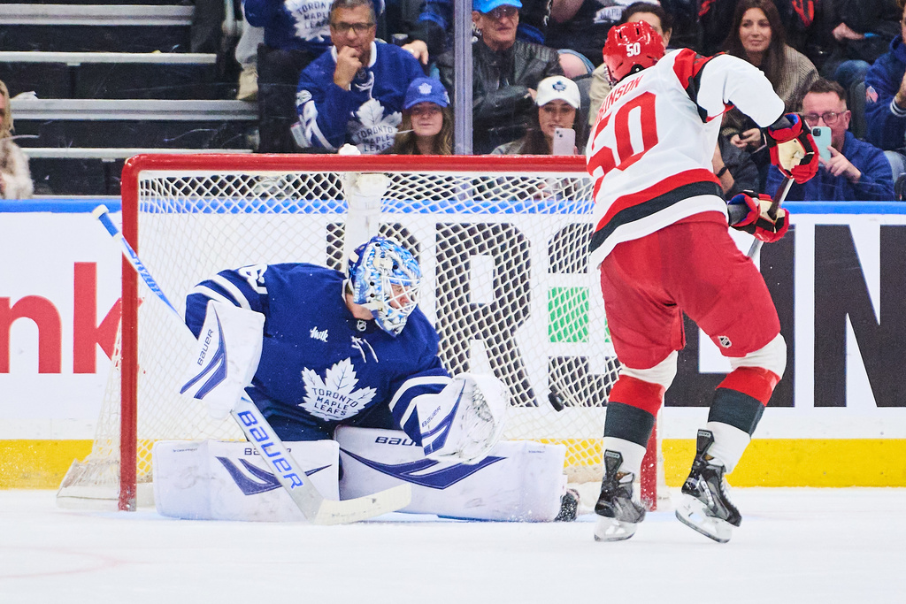 Carolina Hurricanes' Eric Robinson (50) scores on a penalty shot against Toronto Maple Leafs goaltender Joseph Woll, left, during second-period NHL hockey game action in Toronto, Friday, March 20, 2026. (Sammy Kogan/The Canadian Press via AP)