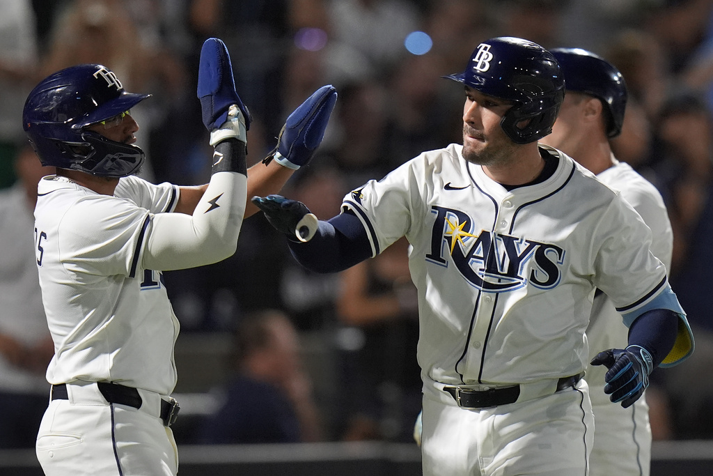 Tampa Bay Rays' Nick Fortes, right, celebrates his three-run home run off Seattle Mariners pitcher Luis Castillo with Richie Palacios, left, during the second inning of a baseball game Monday, Sept. 1, 2025, in Tampa, Fla. (AP Photo/Chris O'Meara)
